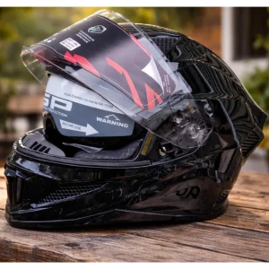 Front view of Steelbird Air SBH-25 ISS Sharp glossy black full face motorsports helmet with transparent visor and chin vents.